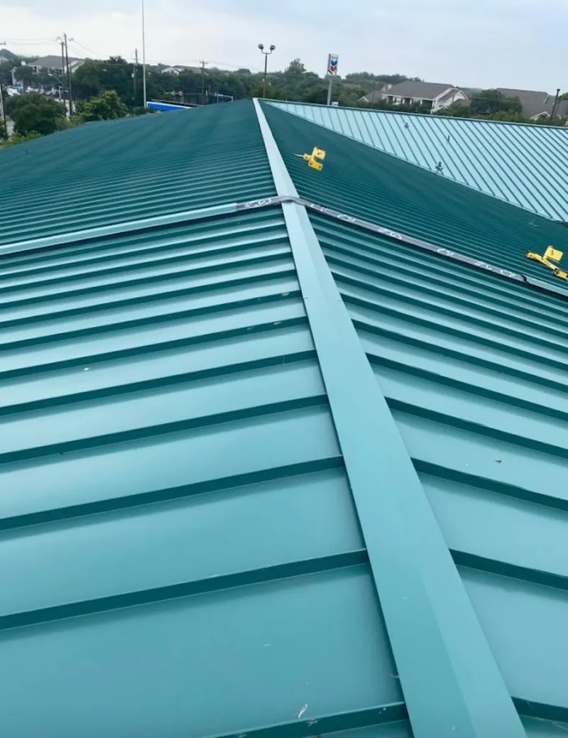 Green commercial metal roof ridge and valley for Metal Roof Repair in Greeley