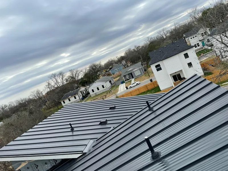 Standing seam metal roof panels with vents for Skylight Repair in Greeley